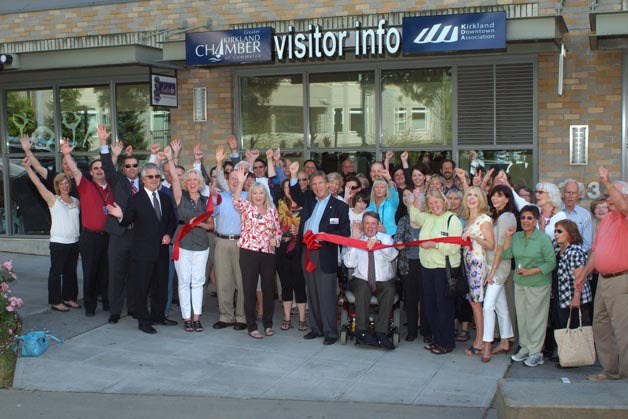The local business community and City of Kirkland officials celebrate the grand opening of the new downtown Visitor Information Center during a ceremony on Wednesday.
