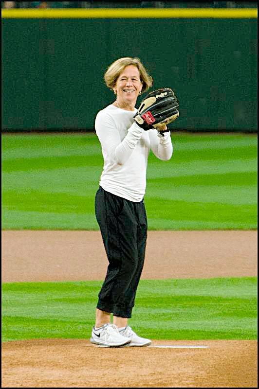 Juanita Elementary PE teacher Lynn Kohlwes throws out the first pitch at a Mariners' game.