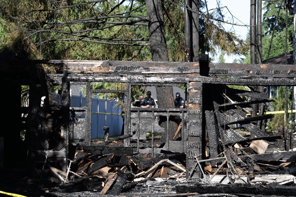 A fire destroyed this abandoned house and an adjacent home's second floor Wednesday night in the 12800 block of N.E. 70th Place in the South Rose Hill neighborhood. The Kirkland Fire Department is still investigating the incident.