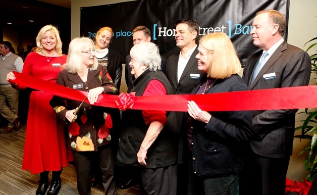Kirkland Mayor Joan McBride cuts the ribbon at HomeStreet Bank's new location at Carillon Point.