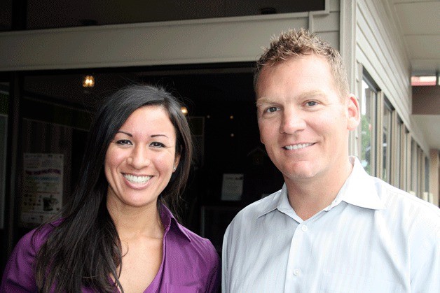 Executive director  Michelle Wilson stands with founder Chad Storey in front of the Asset Realty Group headquarters  located at  Kirkland’s waterfront