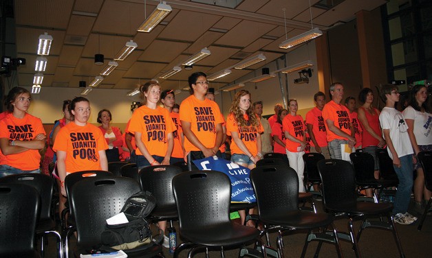 People wearing orange 'Save Juanita Pool' T-shirts packed the Lake Washington School District boardroom on Monday night to show support for a bond measure that would include the pool in Juanita High School's modernization. The school board unanimously passed the bond measure that will not include the pool.