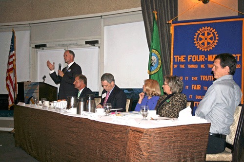 State Senator Rodney Tom answers a question from the audience during a candidate forum at the Woodmark Hotel.