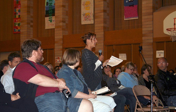 A.G. Bell Elementary parent Shay Harris speaks during the Lake Washington School District public meeting at Bell Elementary on Thursday.