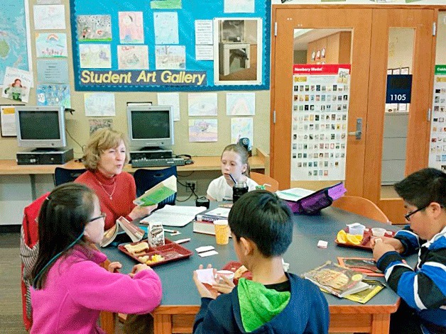 A local Rotarian reads to students at John Muir Elementary in Kirkland.