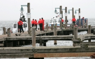King County Sheriff's office divers prepare to use sonar on Tuesday