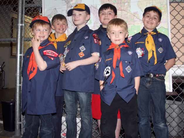 Members of the Tiger and Wolf Den for Pack 567 visited the Kirkland Reporter on Monday.