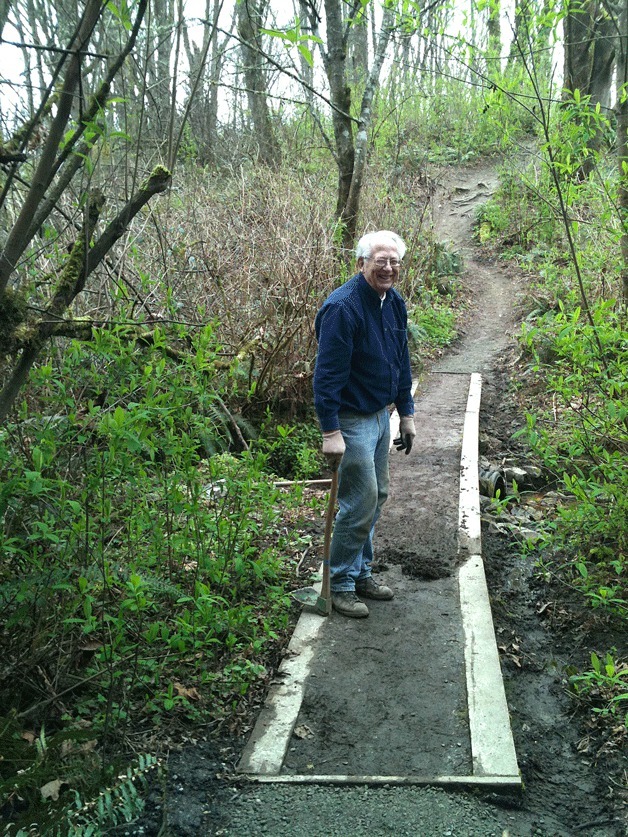 Kirkland resident Stu Clarke fixes up the Cotton Hill Park trail on April 9.