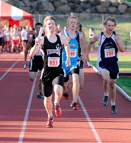 Life-long Kirkland resident Kyle Fremd of Bellevue Christian (#653) runs head to head with Cedar Park Christian’s Jordan Scholten (#700) and Freeman’s Luke Matthews (#786) in the 4x400 meter relay during day one of the 1A track and field state championship meet in Cheney. Fremd had a busy weekend