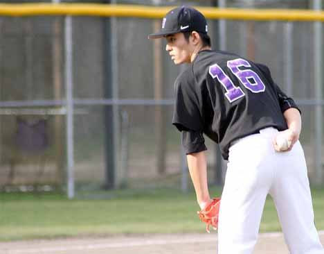 Lake Washington junior Nori Shimizu looks in for the sign from the catcher during the Kangs game against Liberty Monday.