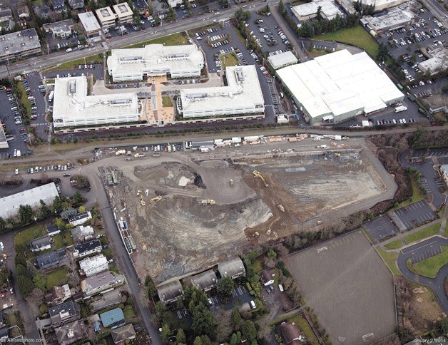 This photo from last winter shows the original Google campus and the clearing of the location for the new building that is currently being constructed.