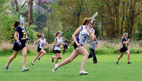 Kirkland resident Maggie Lehr advances the ball for Lake Sammamish against Bellevue during first half action of the game Monday at Marymoor Field. Lake Sammamish won the game against the Bellevue Wolverines