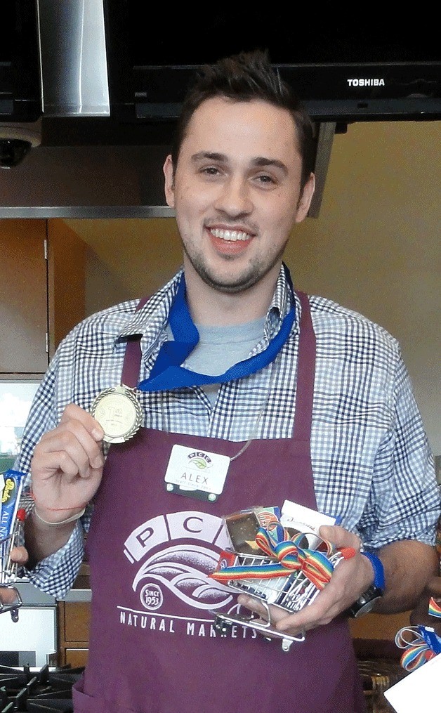 Alex Lavinthal  stands with his store-level medal for winning best bagger of PCC. He will compete in the state Best Bagger contest on Oct. 25 at the Greater Tacoma Convention and Trade Center.