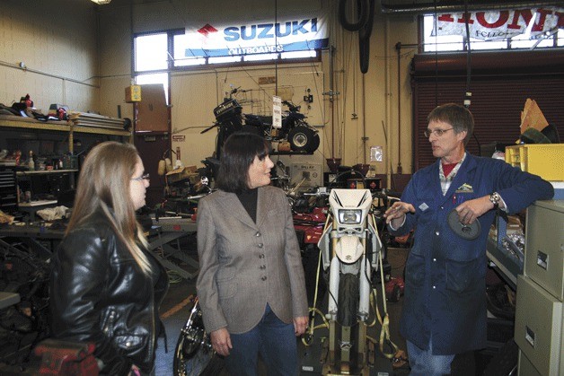 Nova Beckwith shows Congresswoman Suzan DelBene her motorcycle