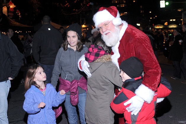 Santa Claus gives hugs during the downtown Kirkland Tree Lighting Ceremony in Kirkland in 2009.