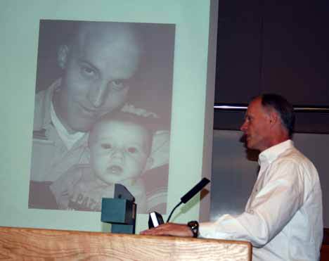 Sen. Rodney Tom (D-Bellevue) testifies in front of a picture of Kollin Neilson and his son to the Kirkland City Transportation Committee Wednesday. Sen. Tom spoke in favor of renaming the N.E. 116th Street bridge over I-405 for Neilson