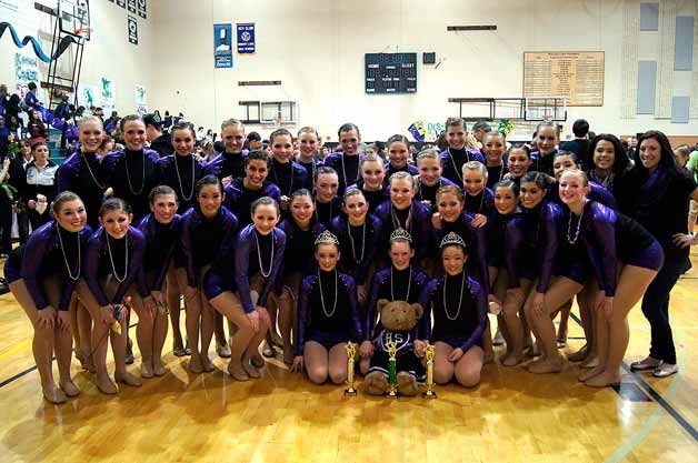 The Lake Washington Dance Team with the state-title trophy.