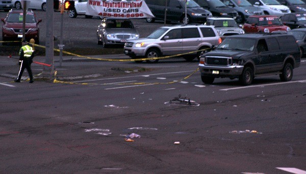 The remains of a bike lay in the middle of the road at the intersection of 132nd Avenue Northeast and Northeast 124th Street after a cyclist was hit and killed early Thursday morning by an SUV.