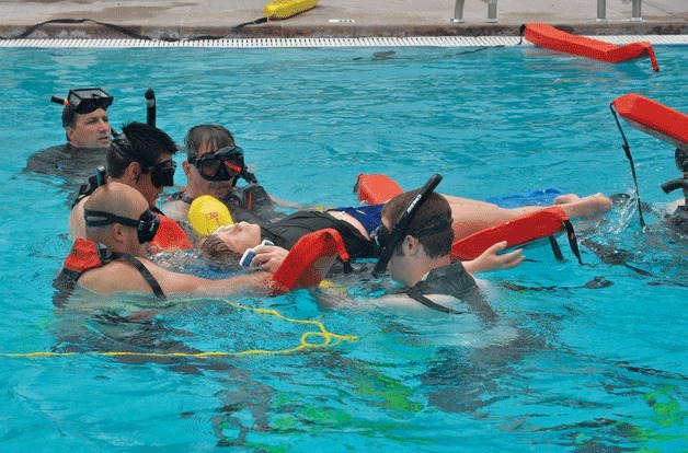 Kirkland firefighters pull a mannequin from the water as part of the department’s training program for water rescues. The majority of Kirkland Fire personnel are trained to perform water rescues.