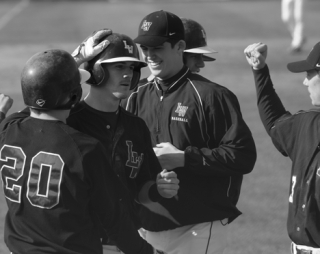 Big blasts: Lake Washington senior Eric Folkers is congratulated by teammates after hitting the first of his two home runs during last Wednesday's 10-5 win against Newport at Bellevue College. Folkers leads the Kangs with four home runs this season.