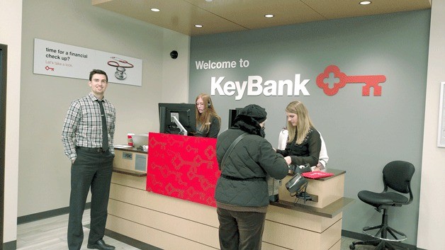 New Kirkland KeyBank Branch Manager Matthew Sheppard with employees at the Central Way location.