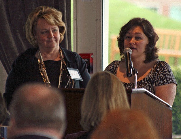 KITH client 'Felicia' talks during a luncheon at the Woodmark Hotel on Friday about her experience with the organization. She is joined by her caseworker Wicki Todd.