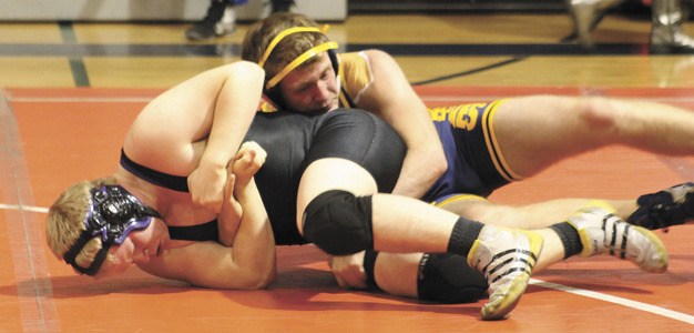 Lake Washington's Jared Parker battles Bellevue during the Kangs double dual against Mercer Island and Juanita on Thursday