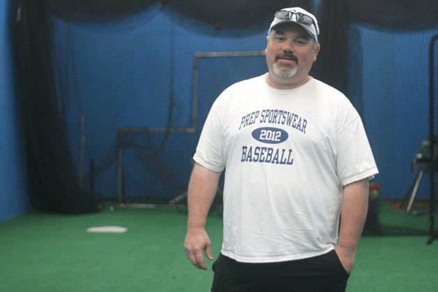 Cody Webster stands in one of the batting cages at the Northshore Sports Complex in Woodinville.