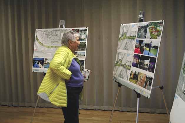A woman views one part of the Cross Kirkland Corridor draft master plan before the community forum and presentation on Feb. 27. The city of Kirkland will hold another community forum on April 26.