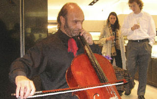 Cellist Ashraf Hakim plays his cello at the Movado Boutique in Bellevue Square on Friday