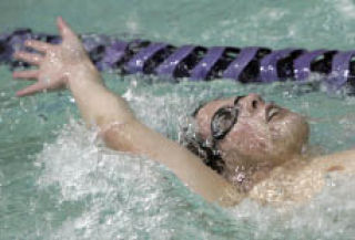 Senior Carl Walsh swims during practice with the Lake Washington High School swim team at Juanita High School on Tues.