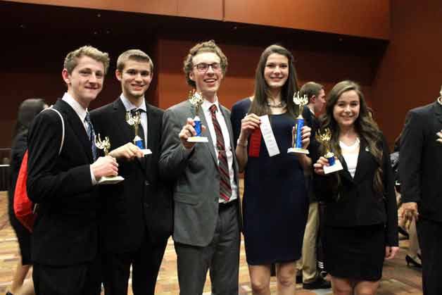 Juanita High School DECA students pose with their trophies from the regional competition.