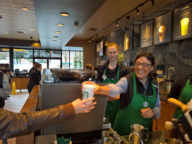 Congresswoman Suzan DelBene serves a customer as a temporary barista at the Starbucks in Kirkland's Houghton neighborhood.