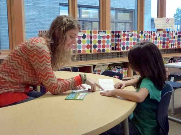 LINKS volunteer Stephanie Baldwin Muir works with a student in the district.
