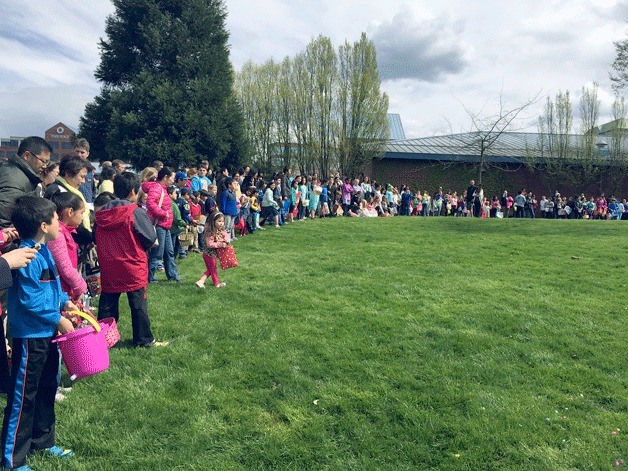 Kids line up prior to the start of the 2015 Kiwanis Easter Egg Hunt at Peter Kirk Park in Kirkland.