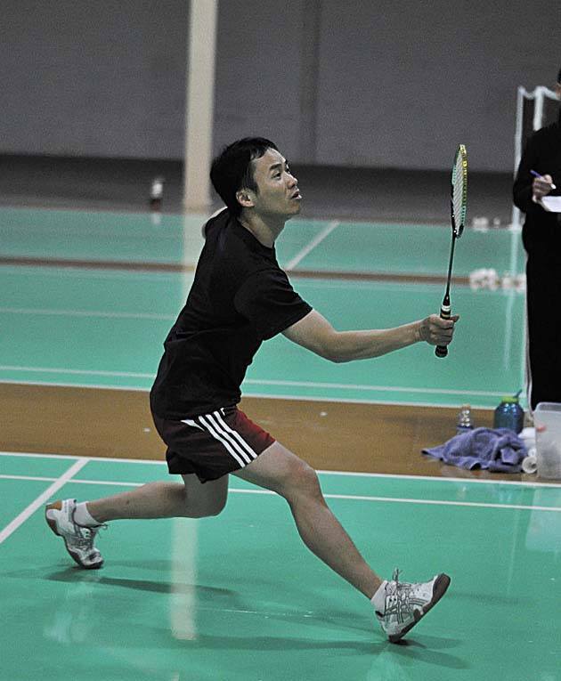 Kevin Yu of Seattle gets close to the net during a game of badminton at the Seattle Badminton Club's newest location in Kirkland.