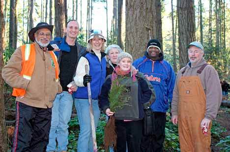King County Councilmember Jane Hague (center) with members of the Denny Creek Neighborhood Association. Hague joined members Dec. 5 to plant new trees in the Juanita Woodlands.