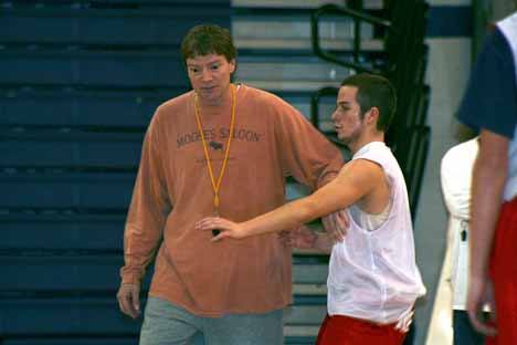 Jeff Patrick works with a Juanita High School basketball player during a preseason practice in November.