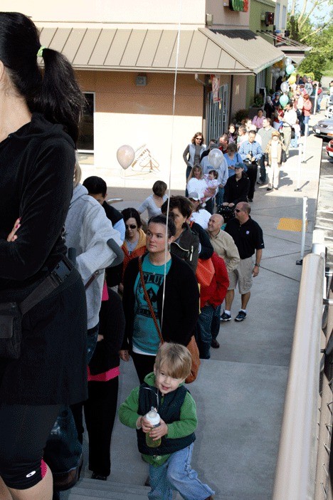 A line of more than 500 people wait to shop at the new Metropolitan Market in Kirkland on the store's opening day Thursday morning.