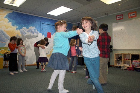 Isabella Adney (left) and Sophie DeRie play a game where they pretend to be specific objects during a class at Studio East in Kirkland.