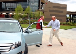 Microsoft CEO Steve Ballmer (right) greets Ford Motor Company CEO Alan Mulally on the Microsoft campus Monday afternoon. Mulally handed the keys of a new SYNC-equipped Fusion Hybrid from Ford of Kirkland to Ballmer.