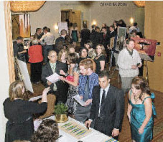 More than 100 gather at a recent benefit event organized by Northwest University students at the Hyatt Regency in Bellevue.