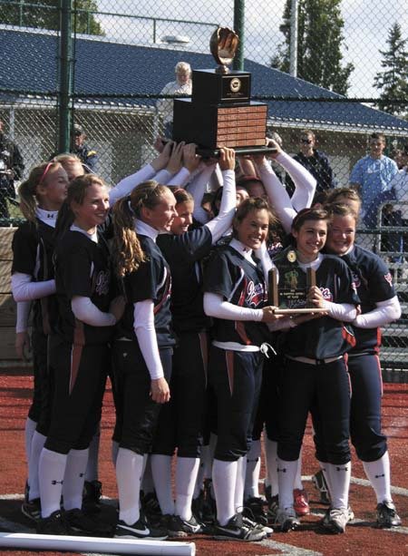The Juanita Rebels celebrate after winning the 3A state softball title in late May in Lacey. The team beat Bainbridge 6-1 in the finals.