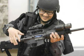 Kirkland Citizen’s Academy student Arthur Chow tries on Special Response Team (SRT) equipment at one of last year’s classes.