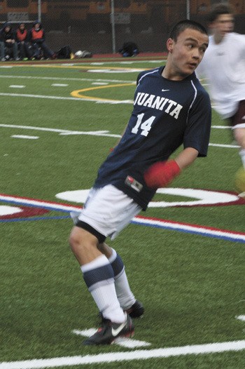 Juanita's Dylan Marshall reacts as the ball wizzes past him during the first half of the Rebels game against Mercer Island. Juanita fell 1-0 to the Islanders.