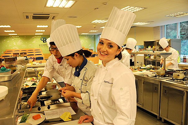 Ana Kasparova works on a dish while studying in Korea. The 23-year-old Bellevue resident is set to graduate from the Lake Washington Institute of Technology’s culinary arts program