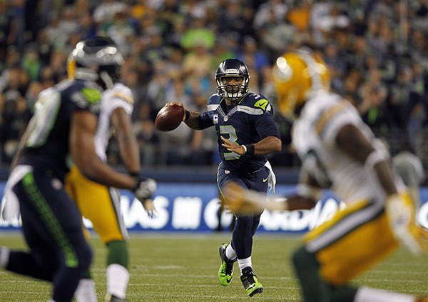Seattle quarterback Russell Wilson looks for a receiver during the Seahawks’ 36-16 victory over the Green Bay Packers in Week 1. The teams will meet Sunday in the NFC championship game.