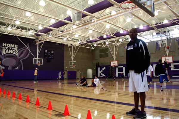 Lake Washington boys basketball head coach Barry Johnson stands in the high school’s brand new gymnasium as his team prepares for an offseason tournament they will host.
