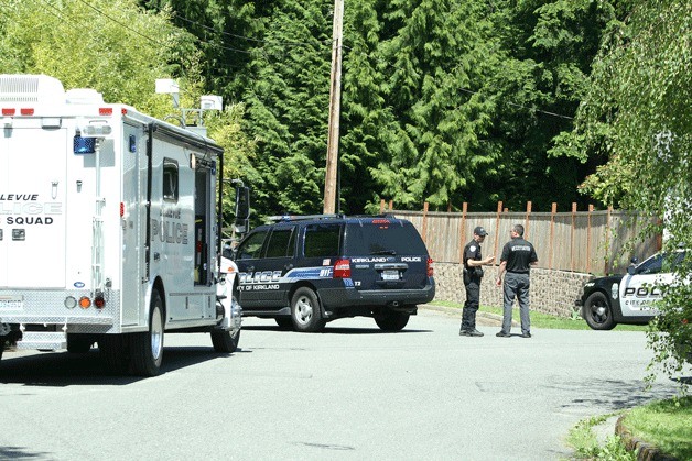 Kirkland police and a Bellevue Police Bomb Squad set up a perimeter along 105th Avenue Northeast near a home that a SWAT team surrounded all day on Monday. Police believe a convicted felon who was involved in a domestic dispute there Sunday night was still inside.
