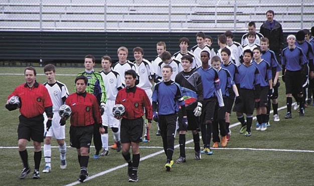 The Impact boys team (right) and Phoenix take the field in the Rec Cup state semi-final game on Dec. 11. The Kirkland team won to advance to the finals.